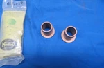 2 Nos Norton Commando, Swing-arm Pivot Bushings (pre MK3), Long # 06-0447. Fixed Price $24.95.