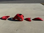 Red Buell Blast Parts 2008 Tank Cover Fenders Tail. Fixed Price $400.00.